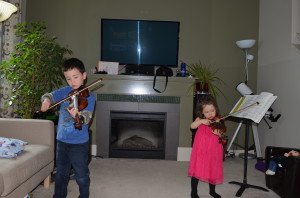 Madeline and Ryan playing the violin together