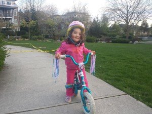 Madeline bikes by herself!